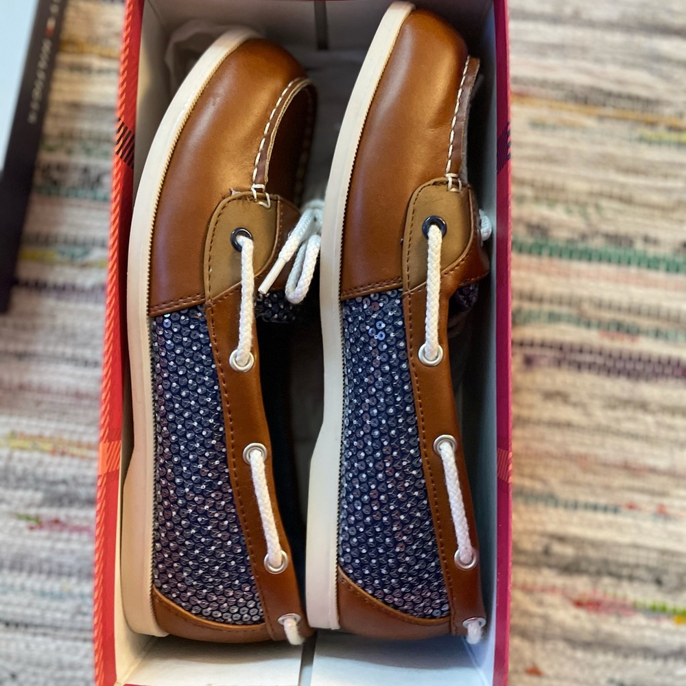 Tommy Hilfiger sip on shoes